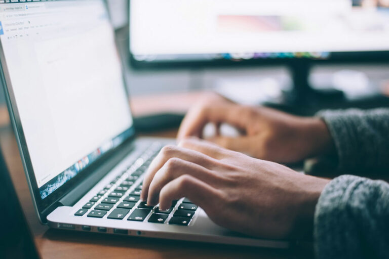 Person typing on a laptop