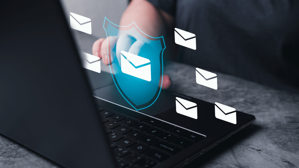 Person uses laptop with envelope icons and a security shield superimposed  