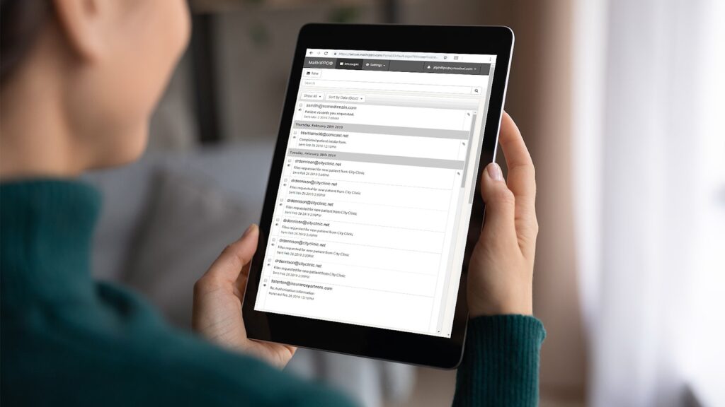 Person uses MailHippo HIPAA-compliant email provider on tablet