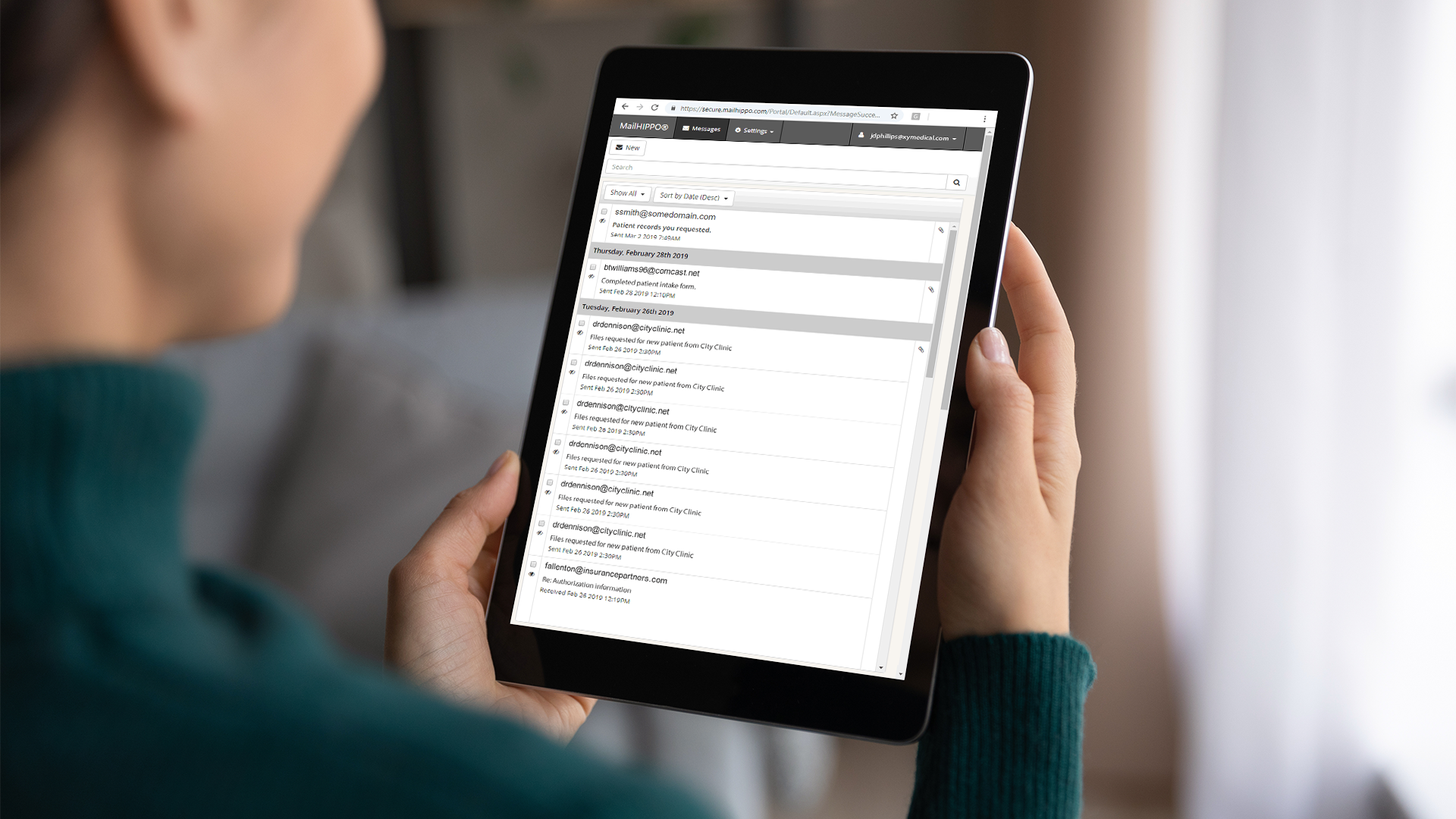 Woman uses MailHippo on tablet